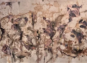 A painting of brown and white paint on the wall.